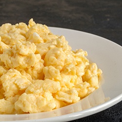 Close-up of a plate filled with scrambled eggs