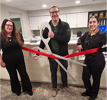 Helping with the ribbon-cutting of Woodside Dental Care, Assonet, MA are team members (left to right) Sue Evangelho, Office Manager; Dr. Derek Cornetta, DDS, FAGD, the director of the dental practice; and Kayla Moniz, Dental Hygienist.  